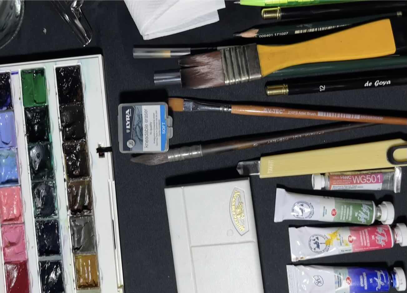 Watercolor materials, palette swatches, and basic brushstroke practice